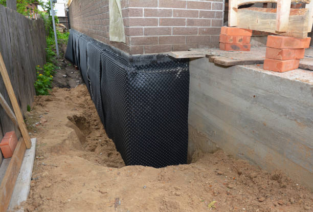 Happy homeowners after waterproofing job in Shirley